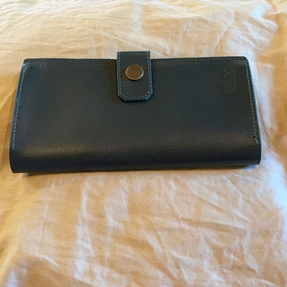 Handmade leather wallet, never carried. Brand new.